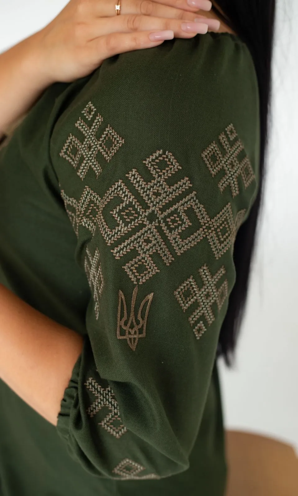 Women's vyshyvanka blouse with embroidered Ukrainian symbols