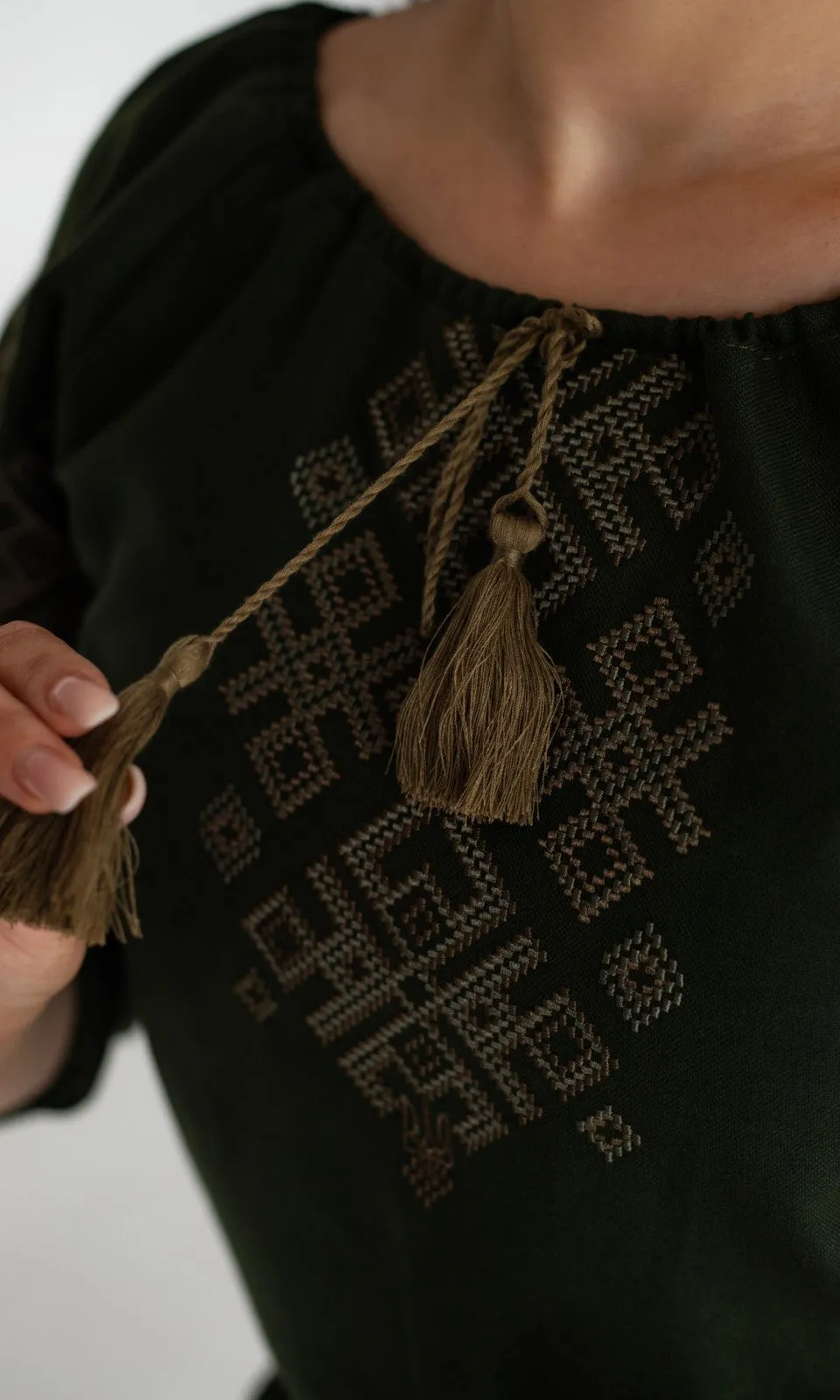 Women's vyshyvanka blouse with embroidered Ukrainian symbols